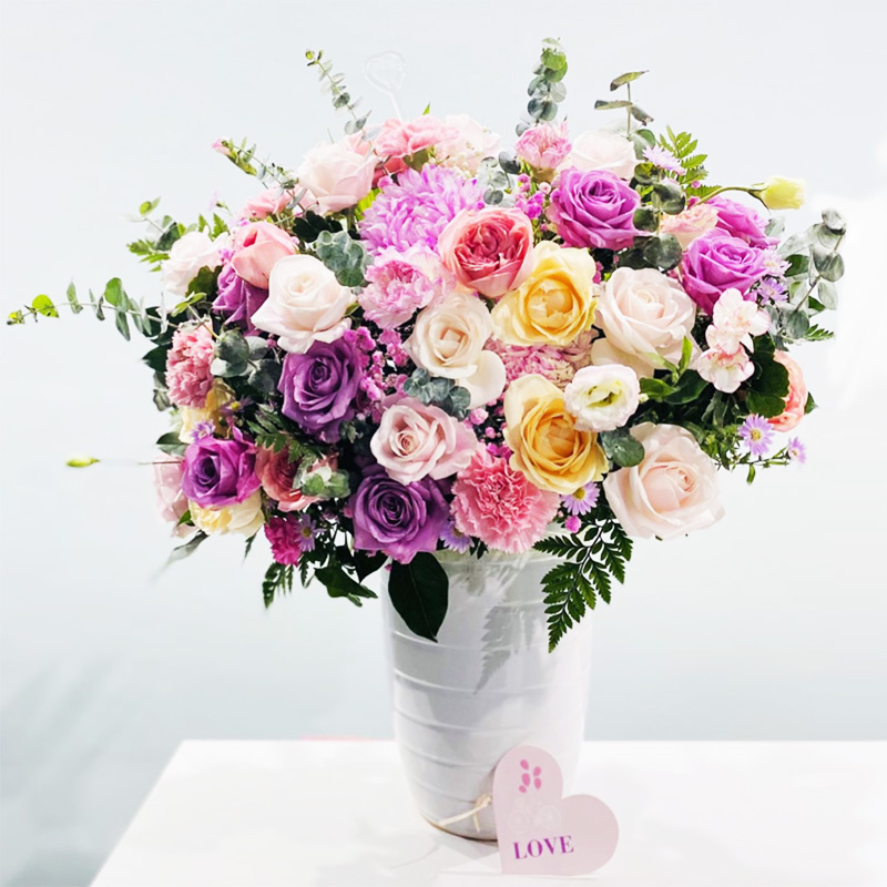 Two Dozen Assorted Roses in a Vase
